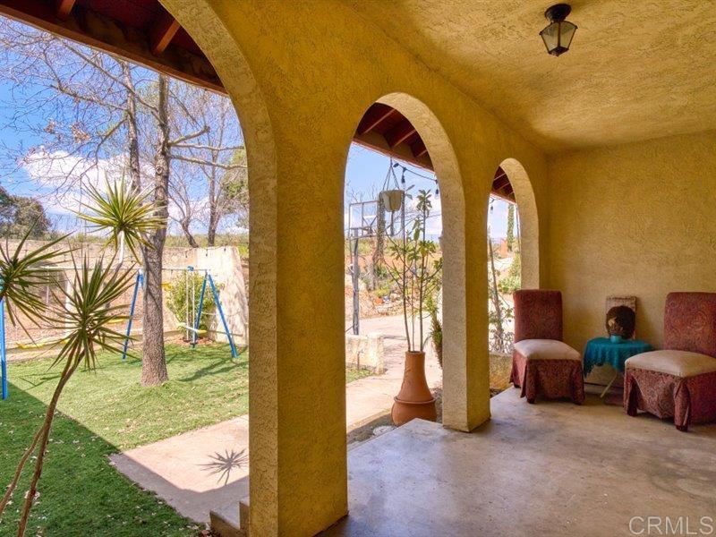 13913 Via De Jamul Jamul Ca Jamul, CA 91935 - Photo 41 of 67 a view of living room filled with furniture and a yard