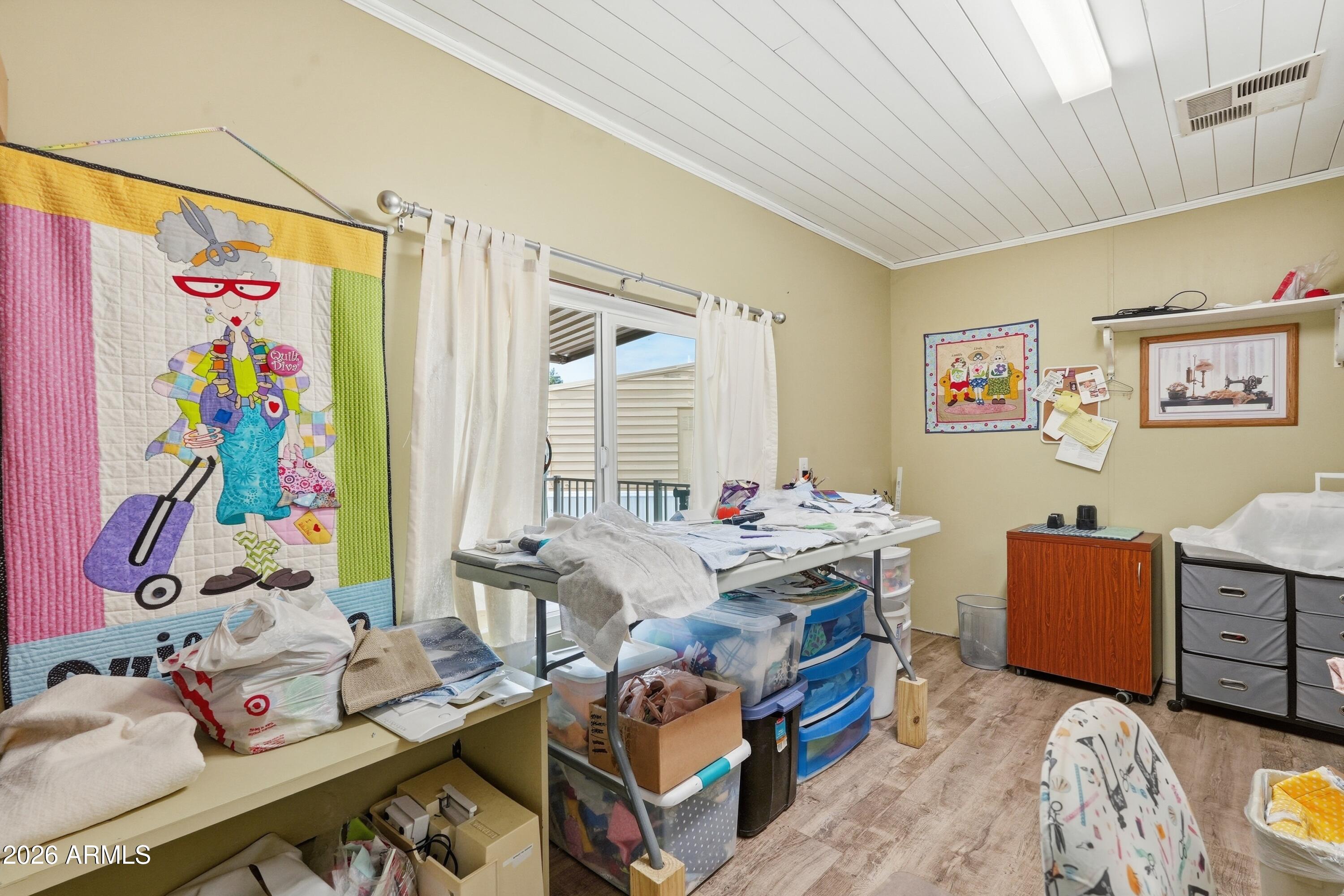 11100 West Alsdorf Road, Unit 50 Arizona City, AZ 85123 - Photo 12 of 36 a view of a workspace with furniture and toys