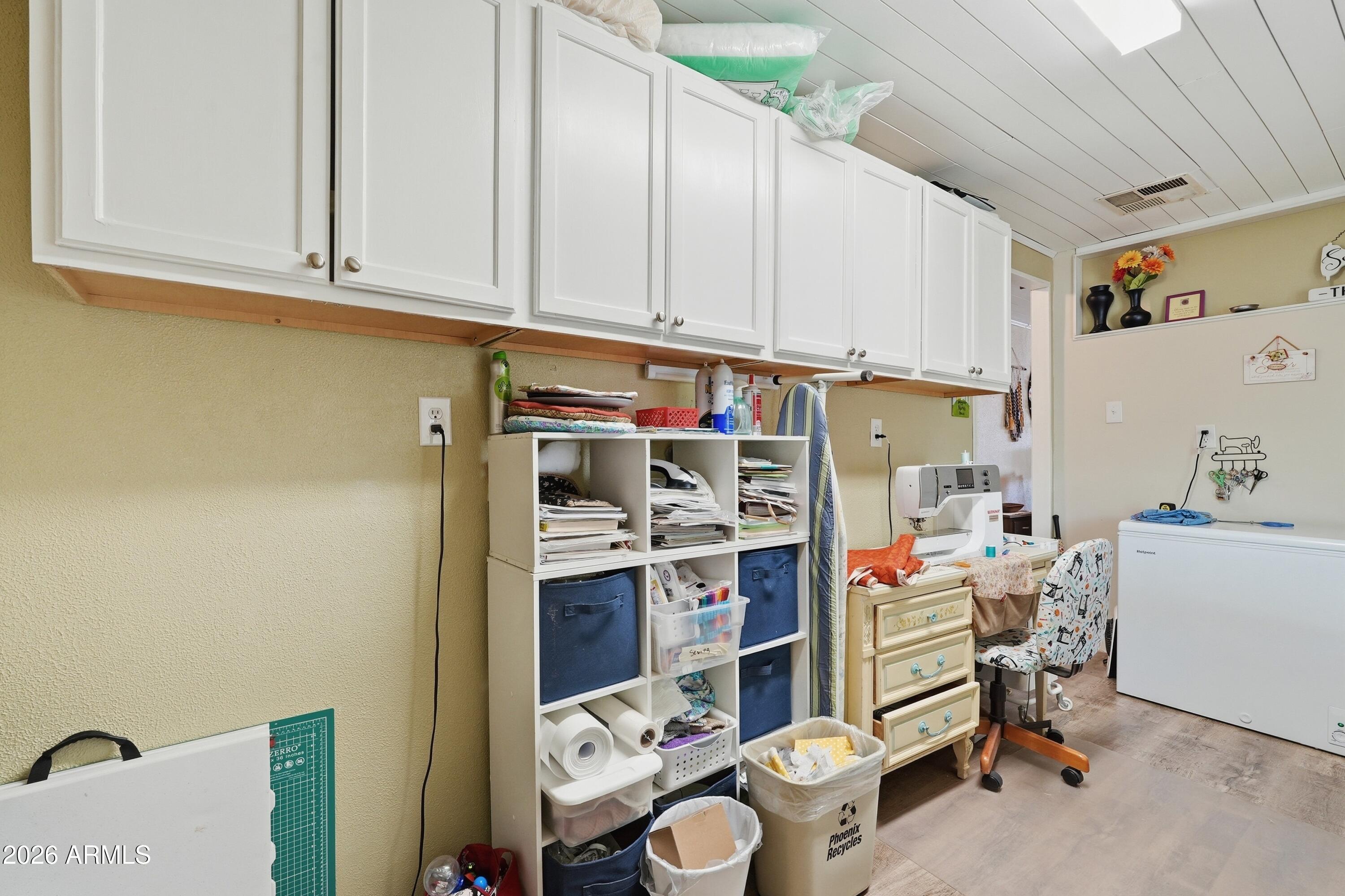 11100 West Alsdorf Road, Unit 50 Arizona City, AZ 85123 - Photo 13 of 36 a view of cabinets and wooden floor