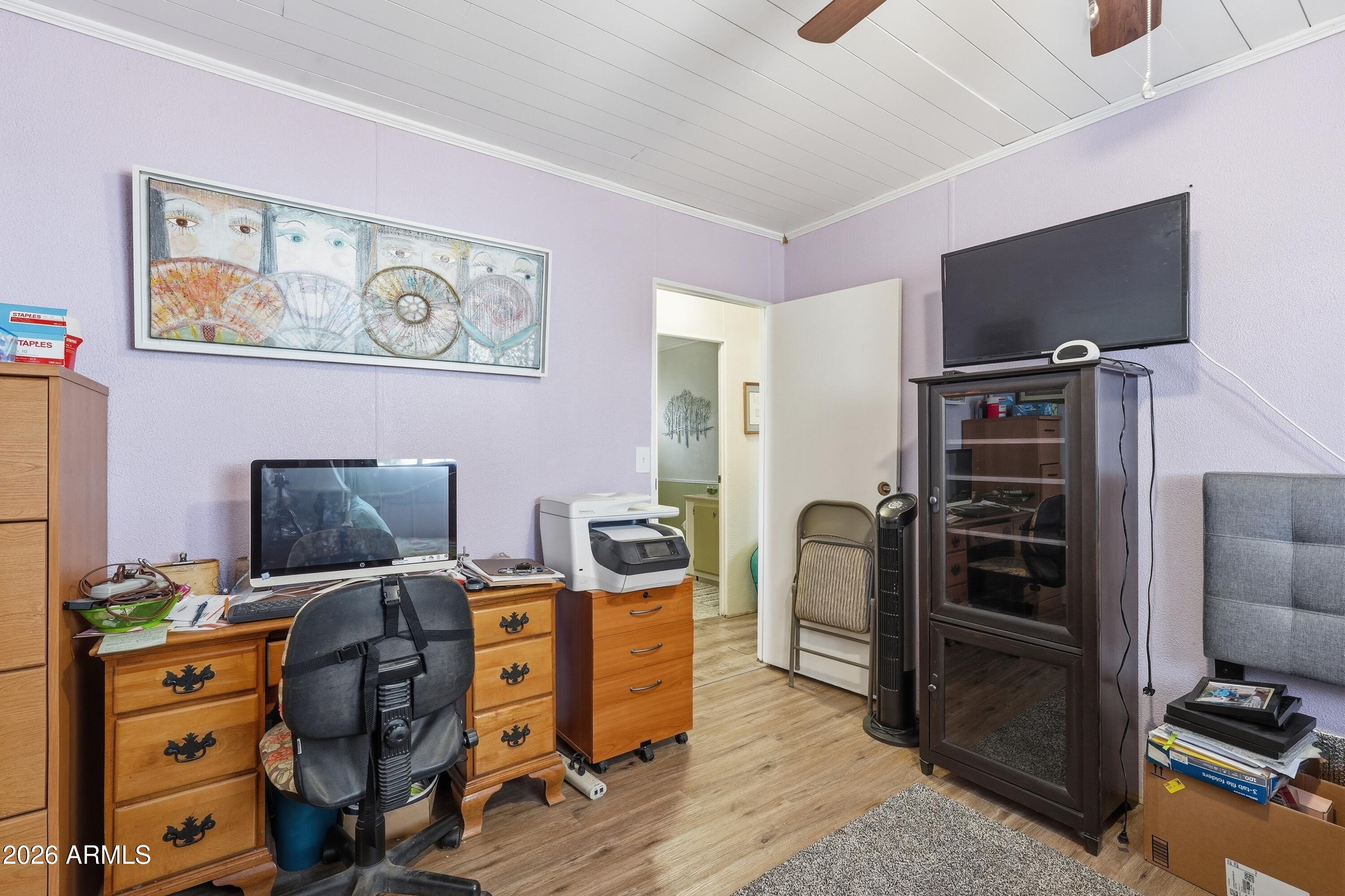 11100 West Alsdorf Road, Unit 50 Arizona City, AZ 85123 - Photo 14 of 36 a view of a workspace with furniture and gym equipment
