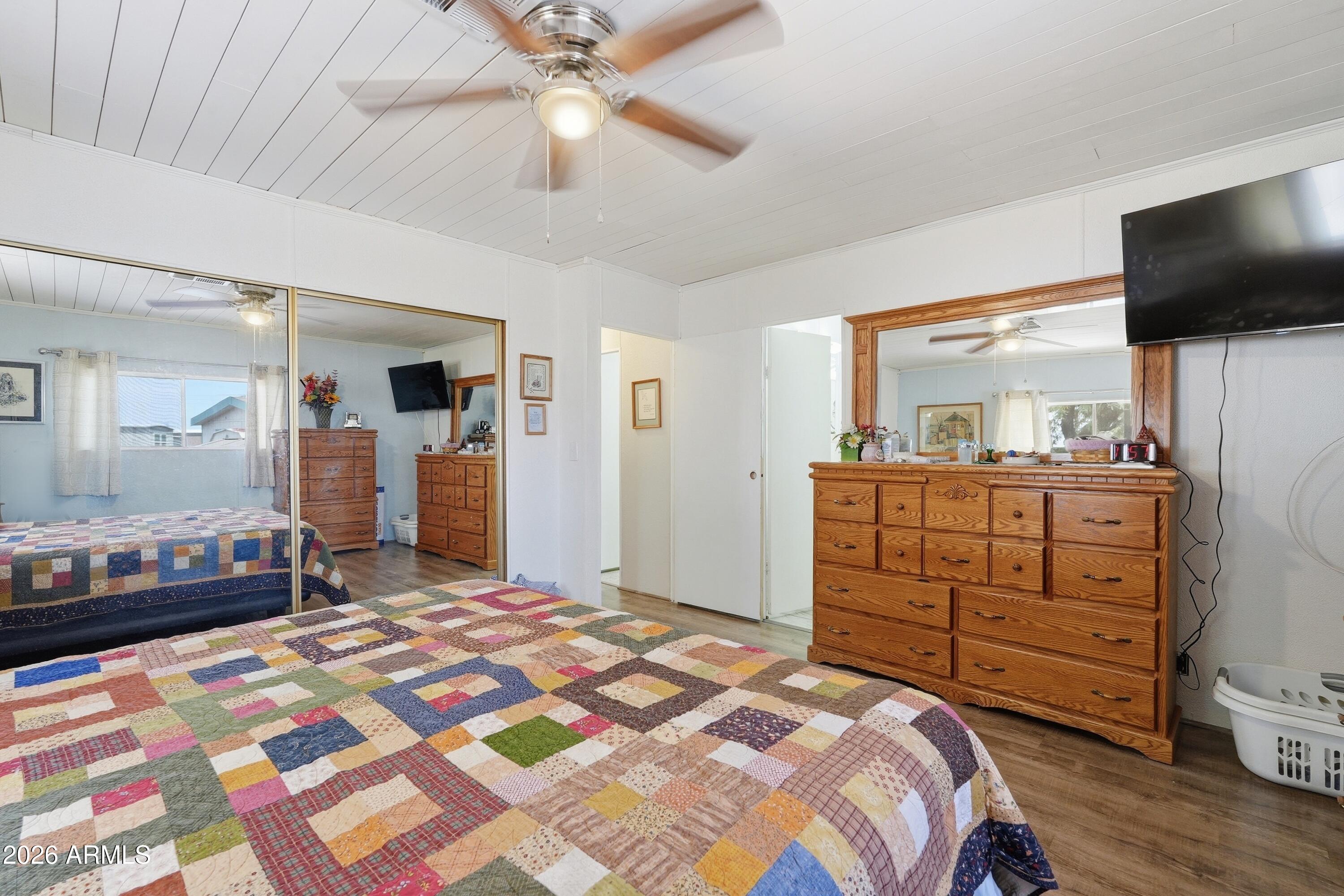 11100 West Alsdorf Road, Unit 50 Arizona City, AZ 85123 - Photo 19 of 36 a bedroom with a bed and a flat screen tv