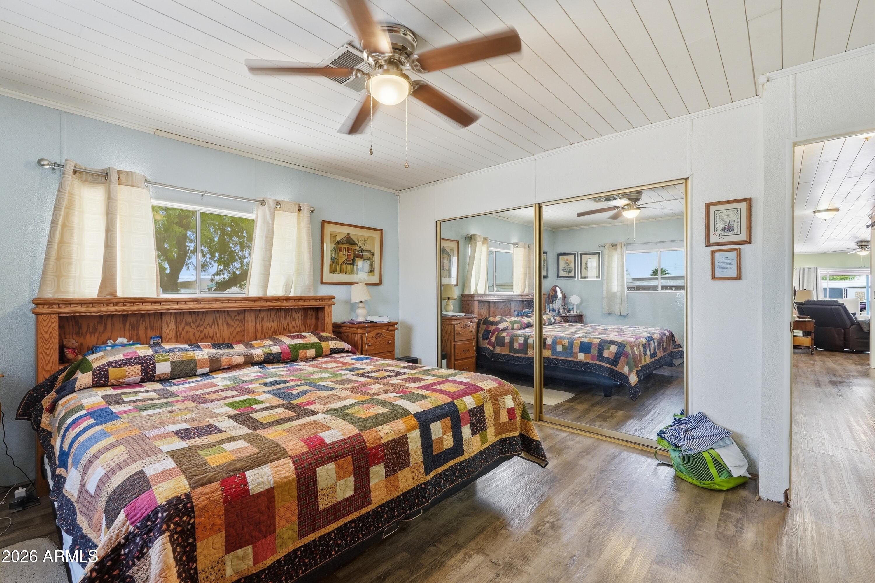 11100 West Alsdorf Road, Unit 50 Arizona City, AZ 85123 - Photo 20 of 36 a bedroom with a bed and ceiling fan