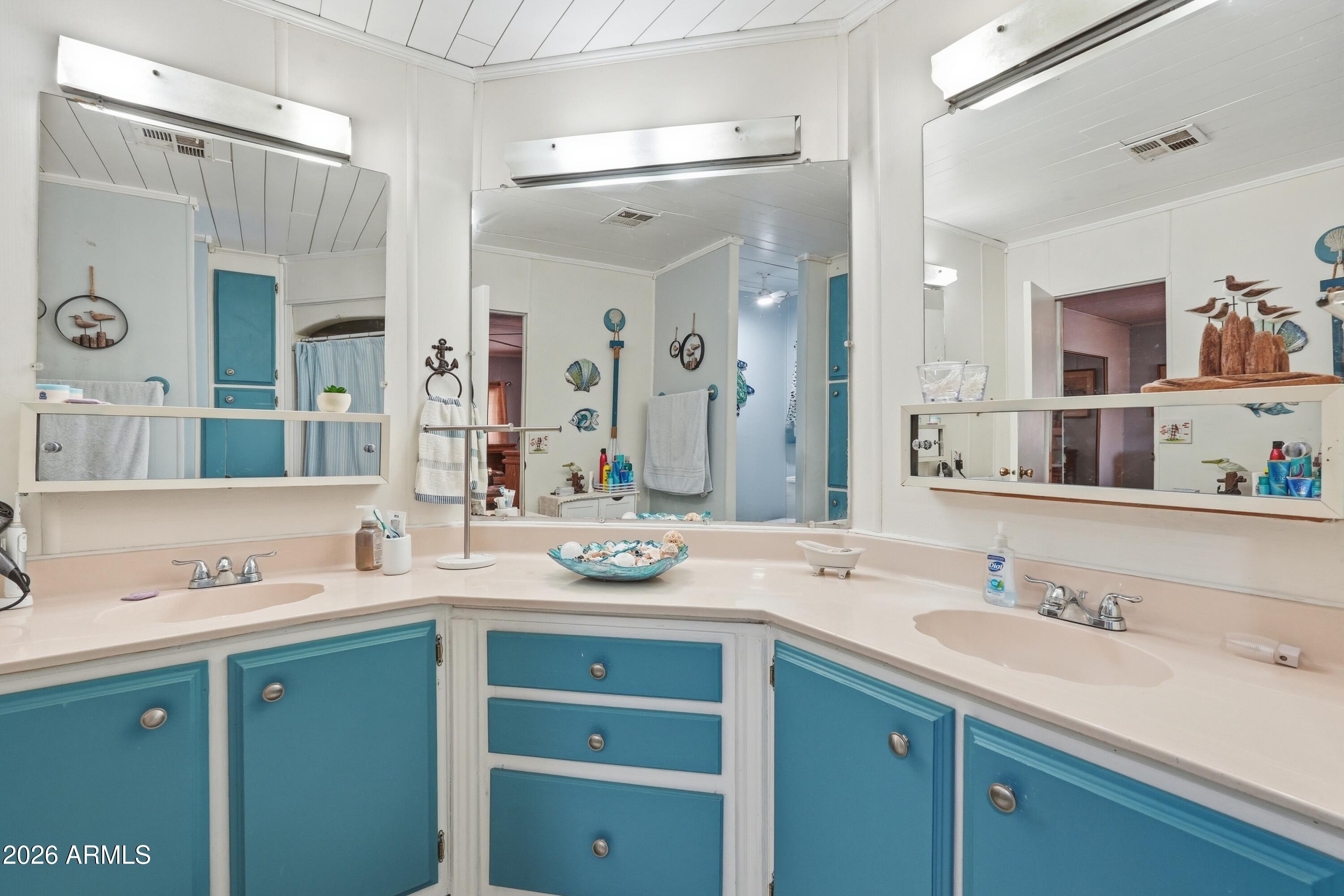 11100 West Alsdorf Road, Unit 50 Arizona City, AZ 85123 - Photo 22 of 36 a bathroom with a granite countertop sink mirror and double