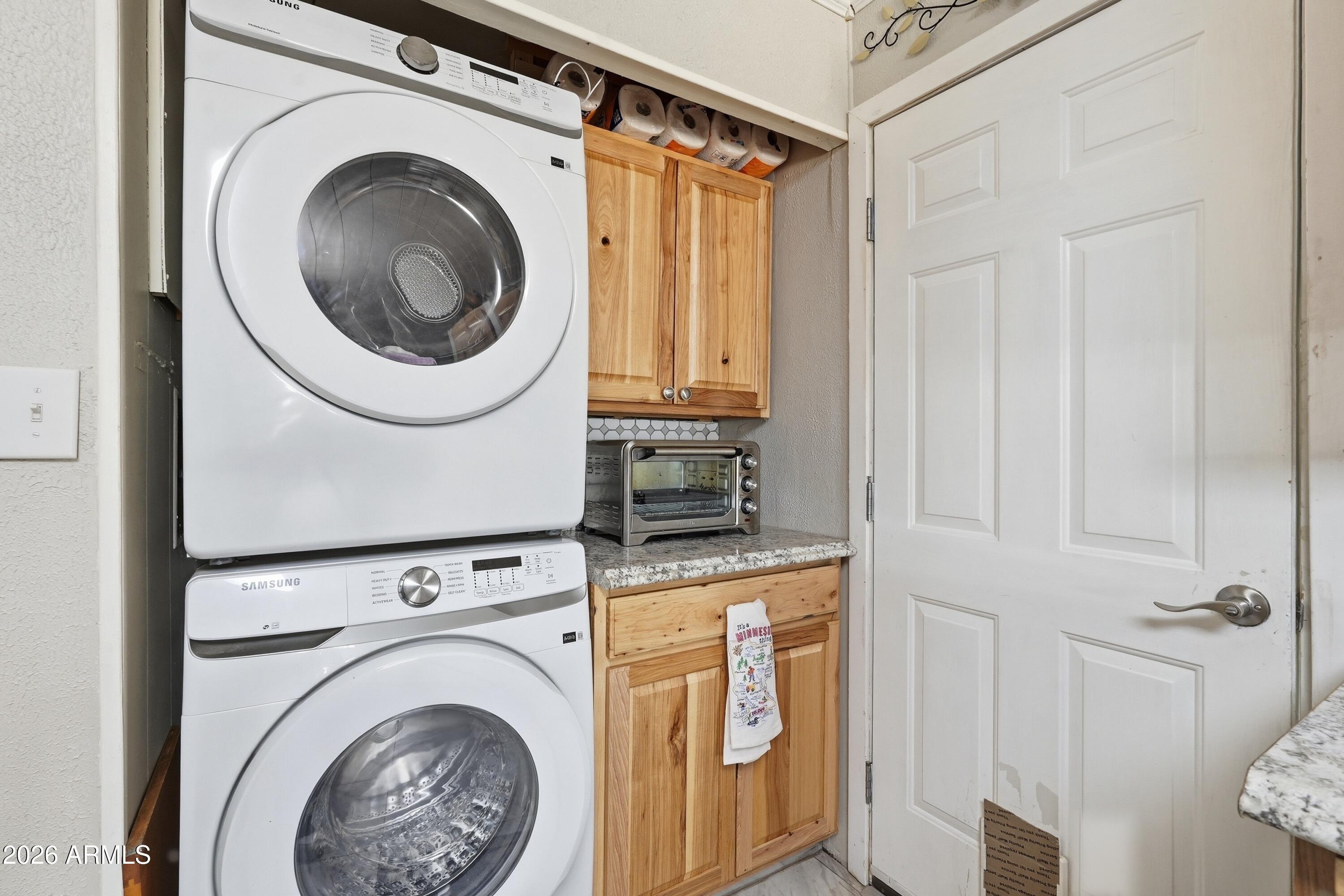 11100 West Alsdorf Road, Unit 50 Arizona City, AZ 85123 - Photo 25 of 36 a view of a storage & utility room with dryer and washer