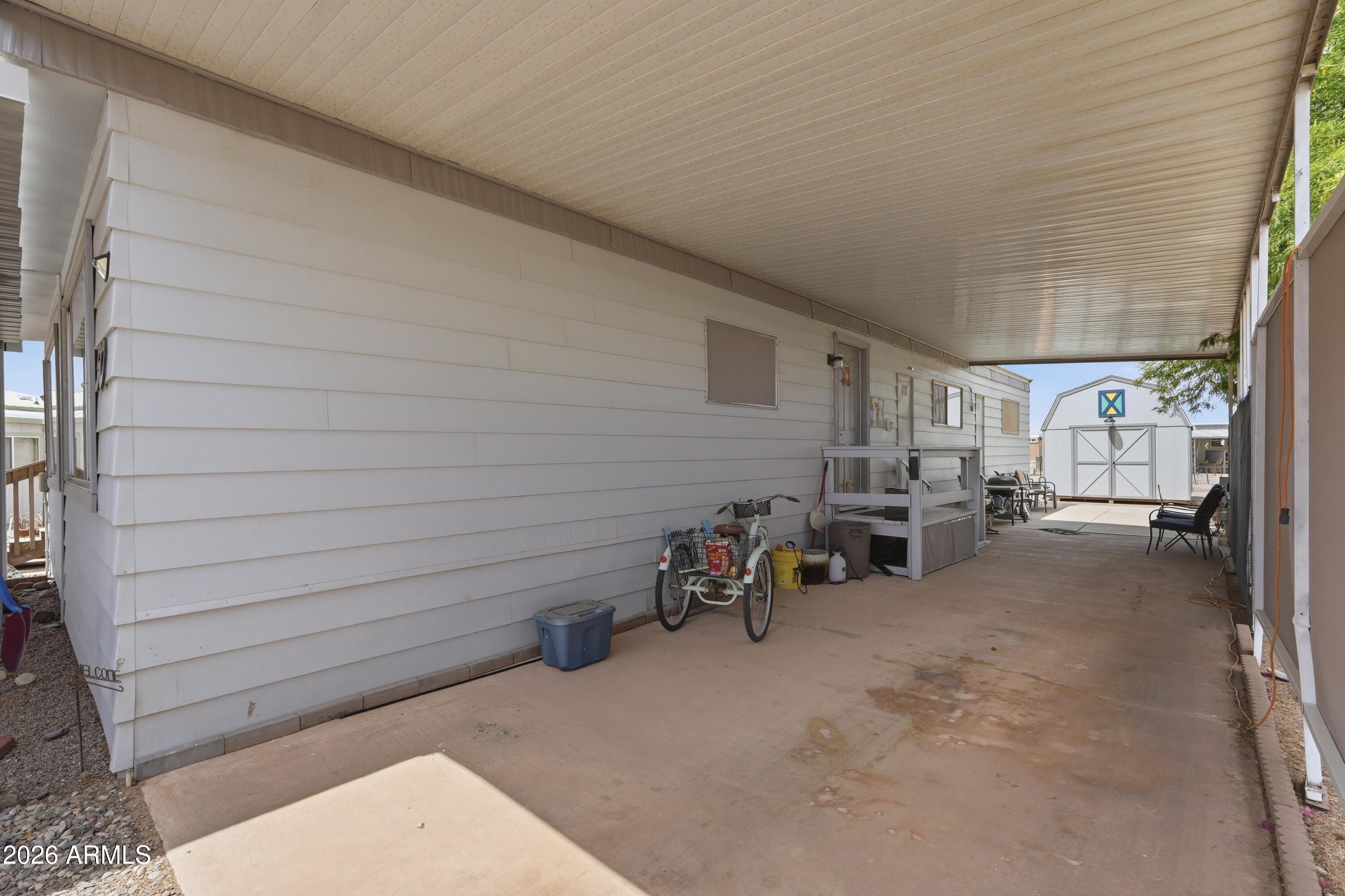 11100 West Alsdorf Road, Unit 50 Arizona City, AZ 85123 - Photo 29 of 36 a view of a patio with table and chairs