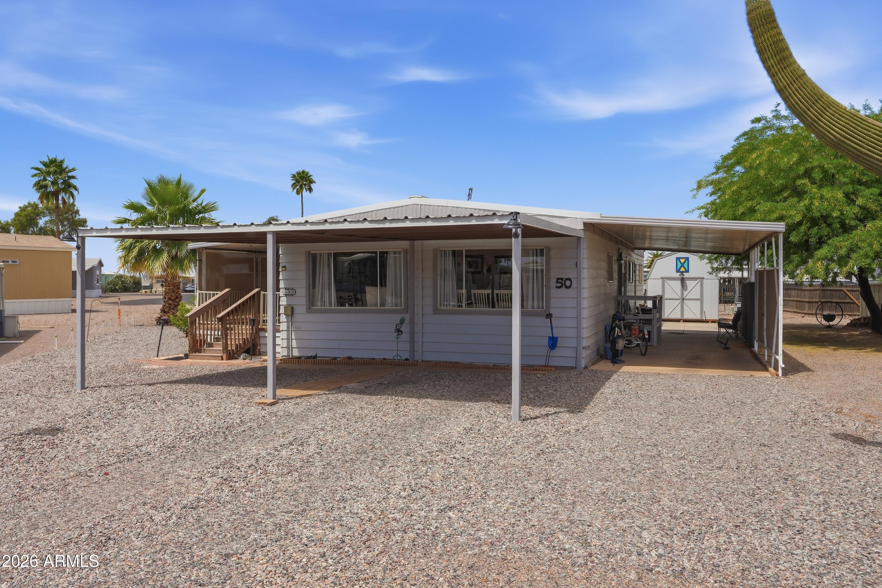 11100 West Alsdorf Road, Unit 50 Arizona City, AZ 85123 - Photo 34 of 36 a front view of a house with a porch