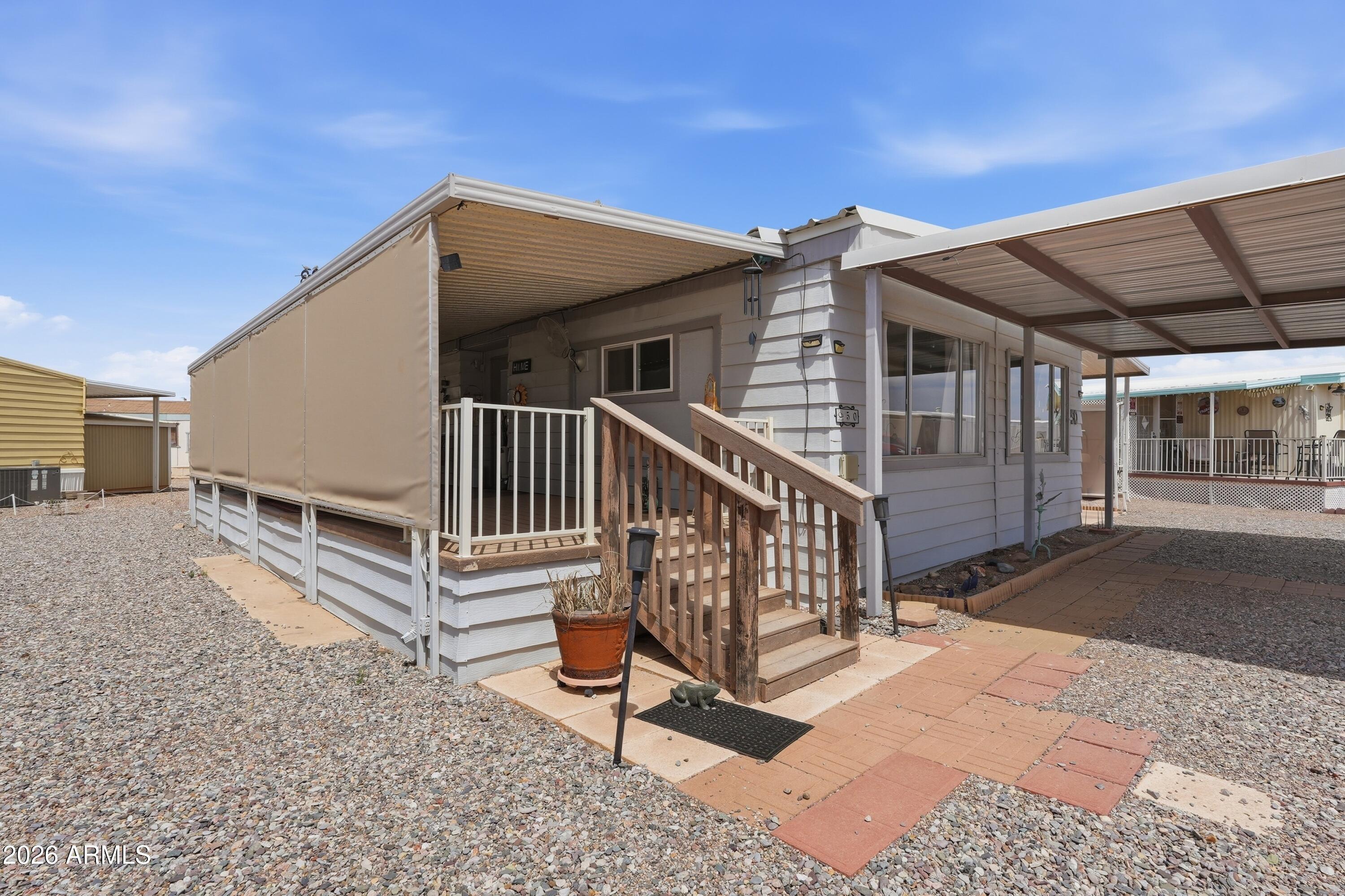 11100 West Alsdorf Road, Unit 50 Arizona City, AZ 85123 - Photo 2 of 36 a view of backyard with deck and deck