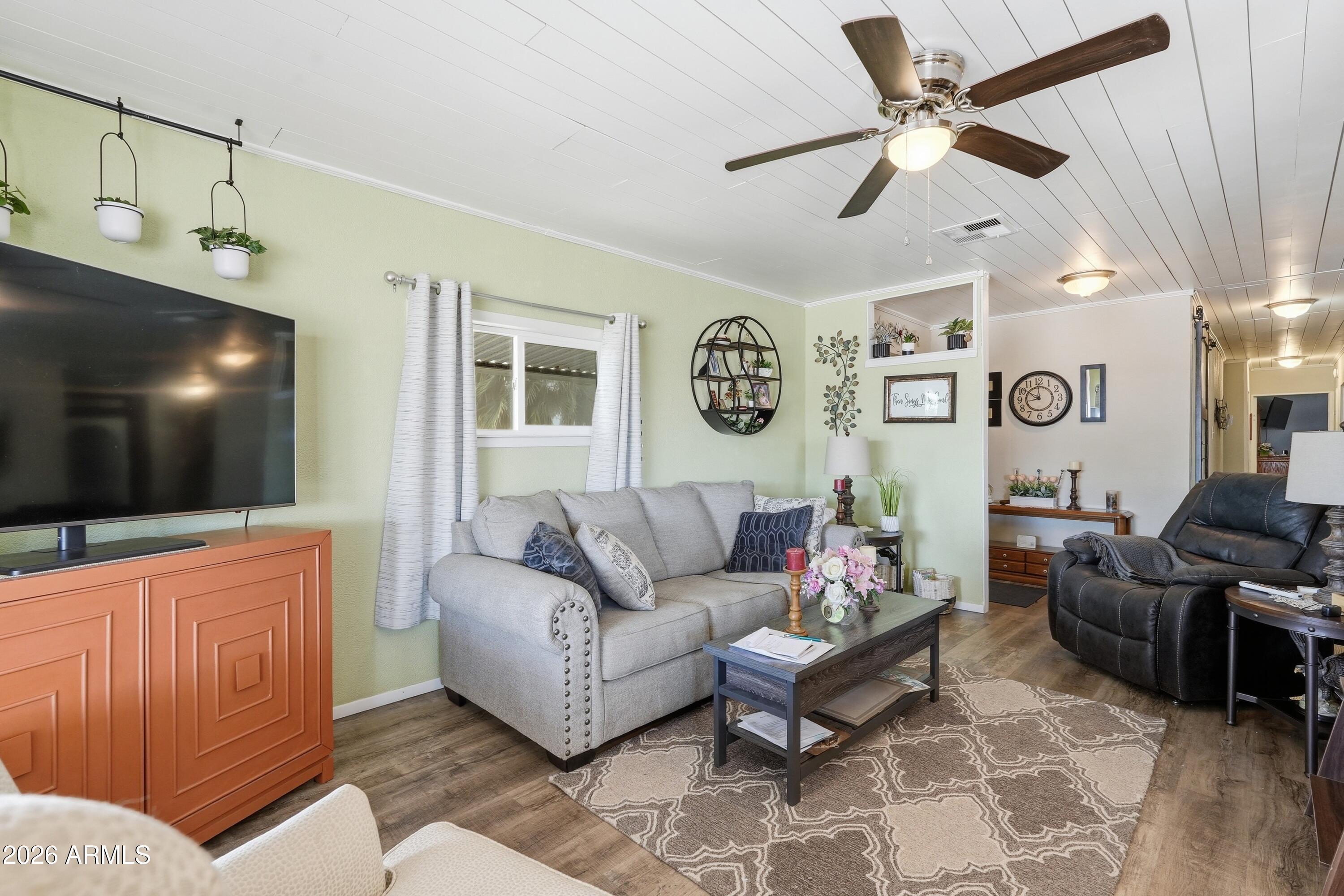 11100 West Alsdorf Road, Unit 50 Arizona City, AZ 85123 - Photo 4 of 36 a living room with furniture and a flat screen tv
