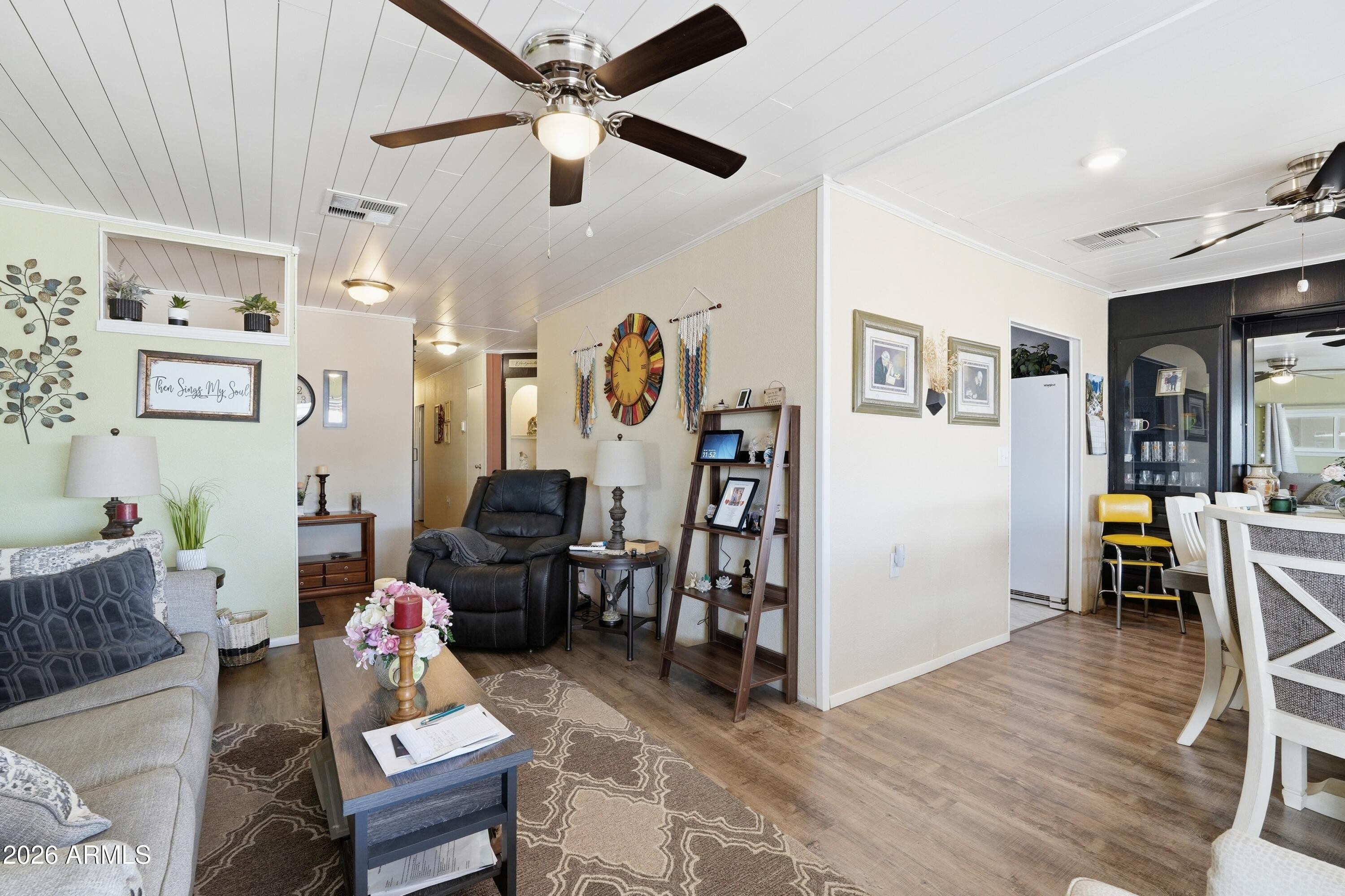 11100 West Alsdorf Road, Unit 50 Arizona City, AZ 85123 - Photo 5 of 36 a living room with furniture and wooden floor