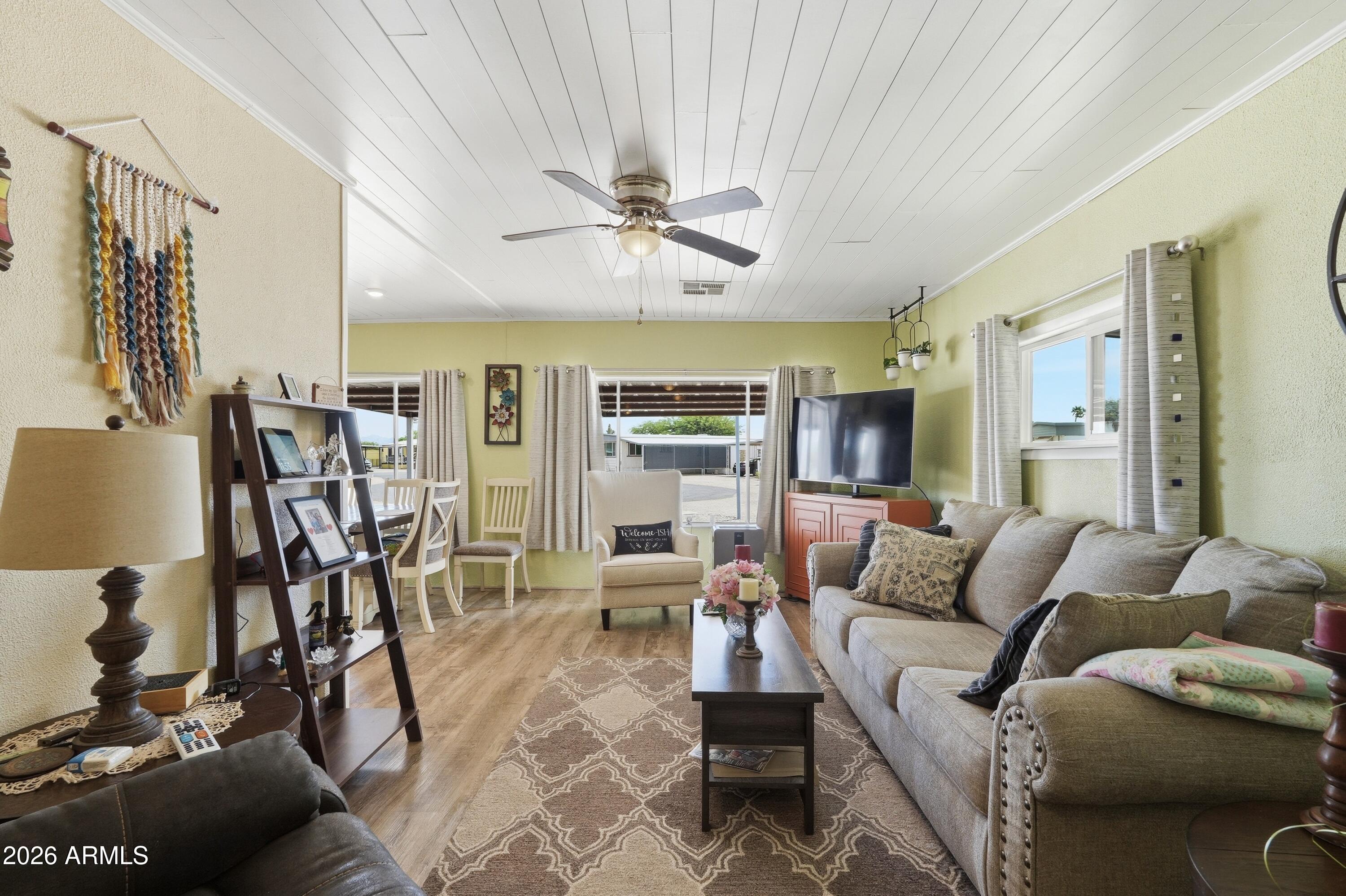 11100 West Alsdorf Road, Unit 50 Arizona City, AZ 85123 - Photo 6 of 36 a living room with furniture and kitchen view