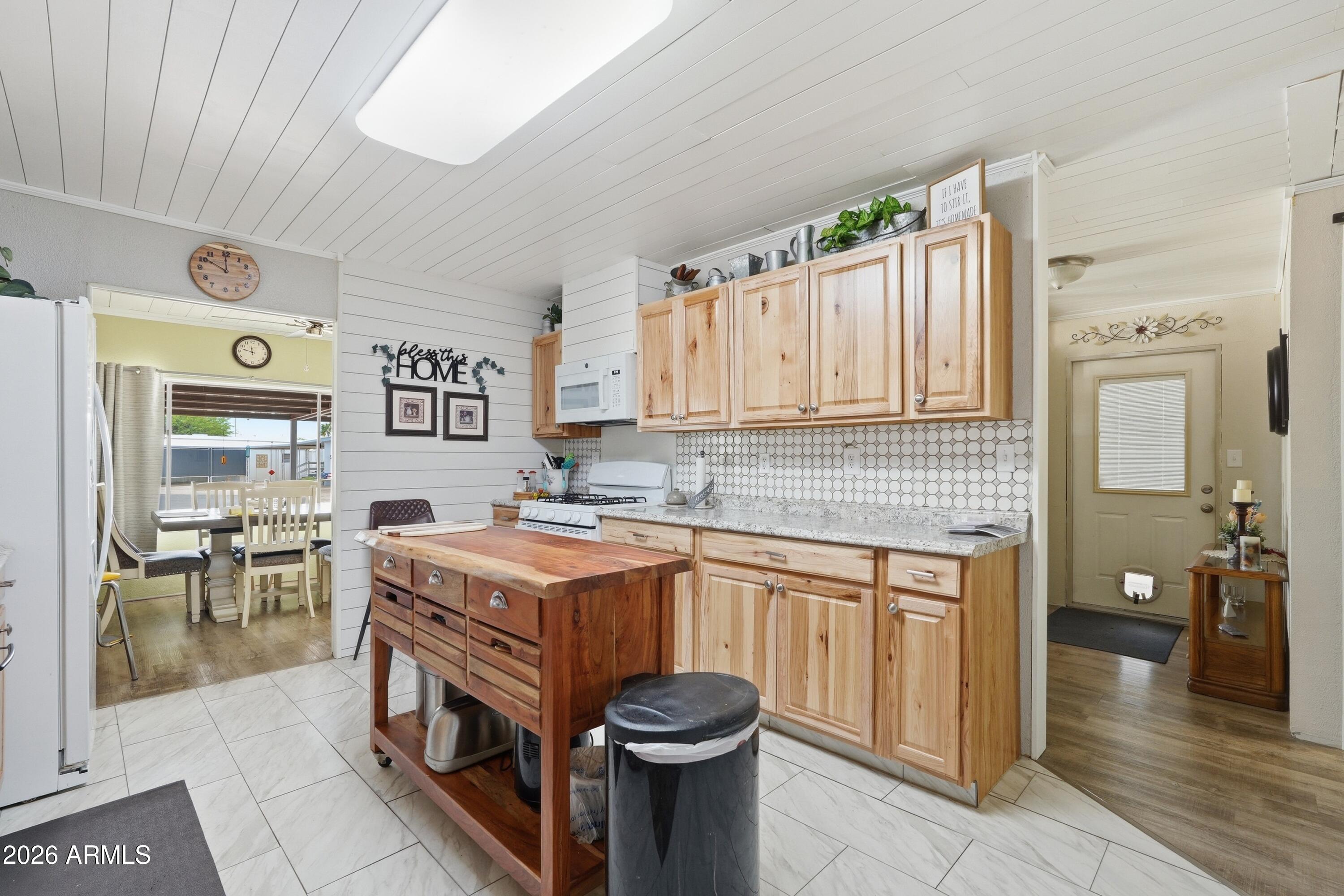 11100 West Alsdorf Road, Unit 50 Arizona City, AZ 85123 - Photo 7 of 36 a kitchen with a sink stove and cabinets