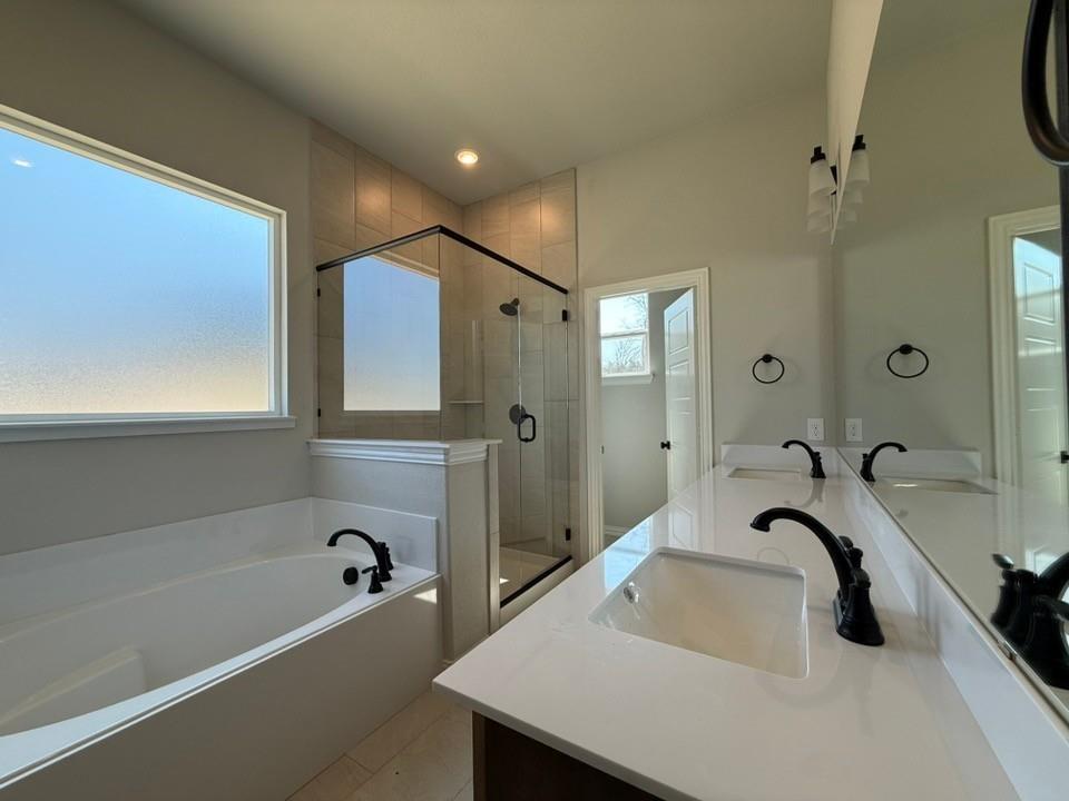 409 Hayden Faith Court Springtown, TX 76082 - Photo 17 of 23 a bathroom with a sink and a bathtub