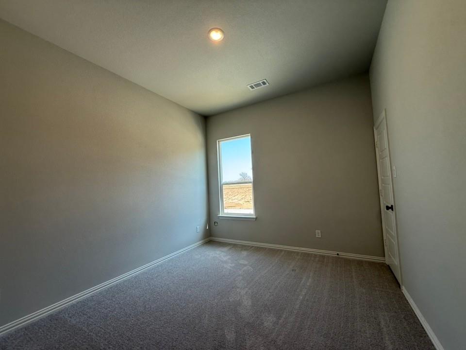 409 Hayden Faith Court Springtown, TX 76082 - Photo 18 of 23 a view of empty room with window