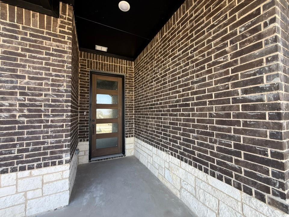 409 Hayden Faith Court Springtown, TX 76082 - Photo 6 of 23 a view of a brick wall