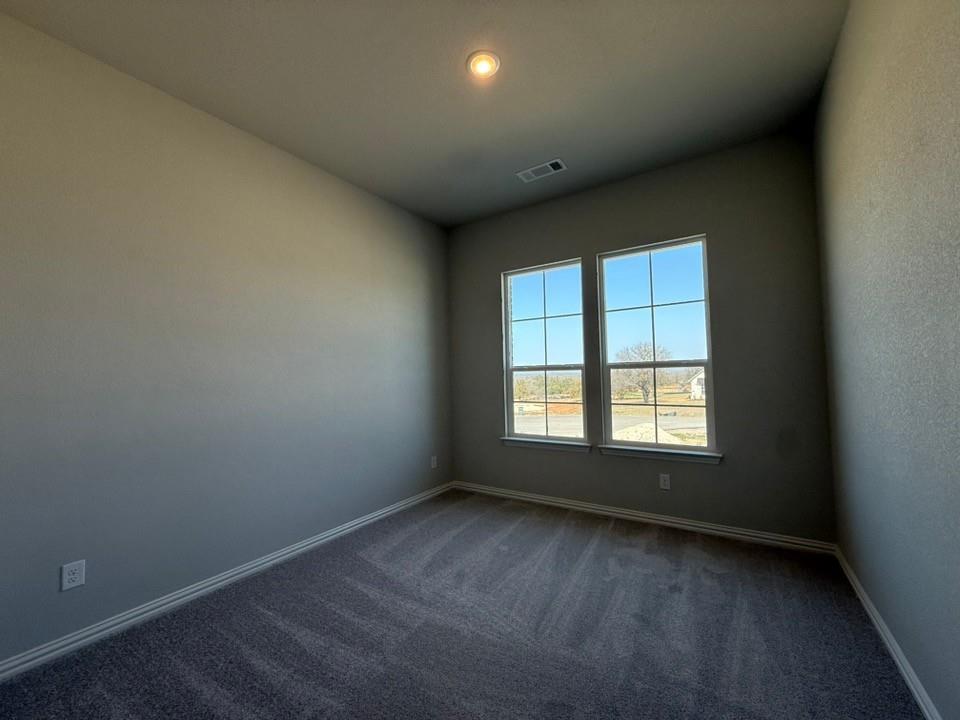 409 Hayden Faith Court Springtown, TX 76082 - Photo 8 of 23 an empty room with a window