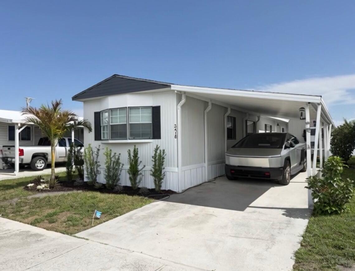 2410 Southwest 50th Street Dania Beach, FL 33312 - Photo 1 of 14 a front view of a house with a yard
