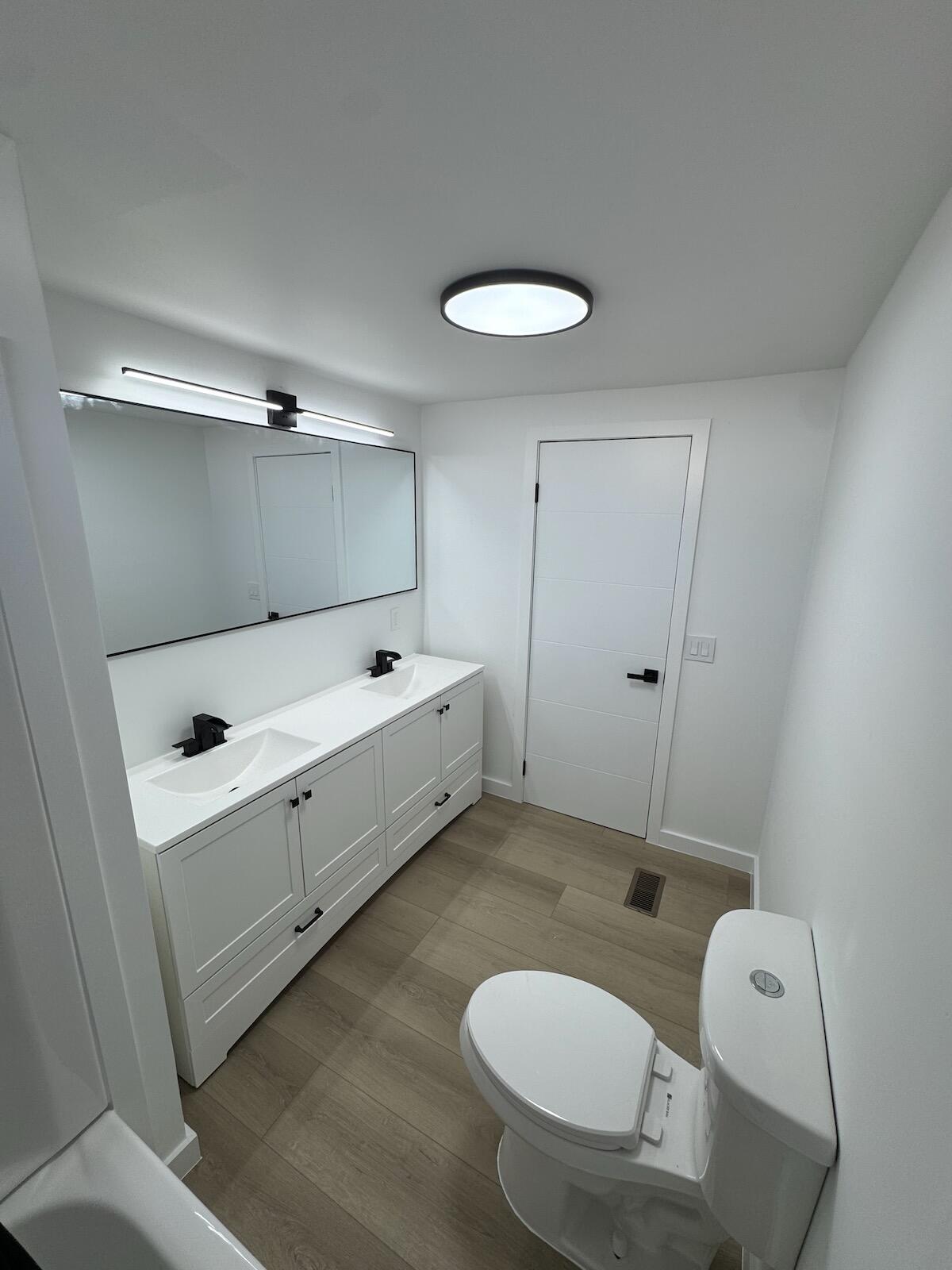 2410 Southwest 50th Street Dania Beach, FL 33312 - Photo 13 of 14 a bathroom with a sink and a mirror