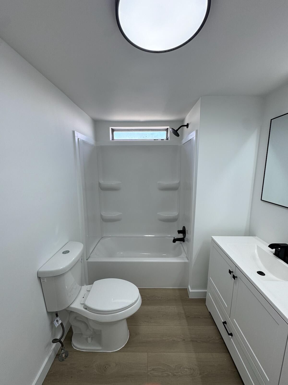 2410 Southwest 50th Street Dania Beach, FL 33312 - Photo 14 of 14 a bathroom with a toilet a sink and bathtub