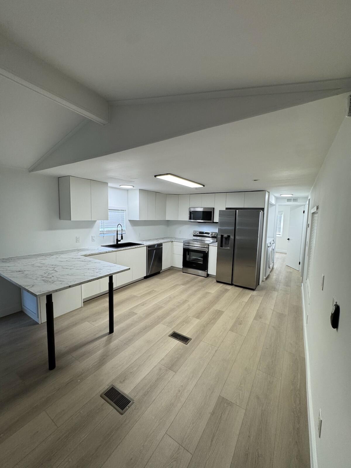 2410 Southwest 50th Street Dania Beach, FL 33312 - Photo 7 of 14 a view of kitchen with furniture and refrigerator