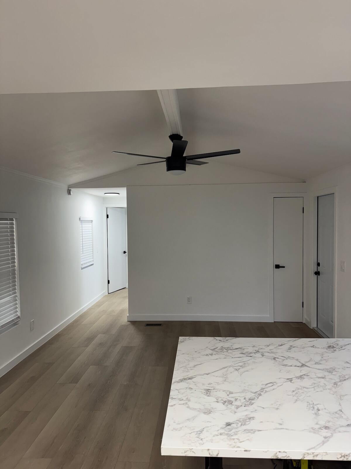 2410 Southwest 50th Street Dania Beach, FL 33312 - Photo 9 of 14 an empty room with wooden floor and windows