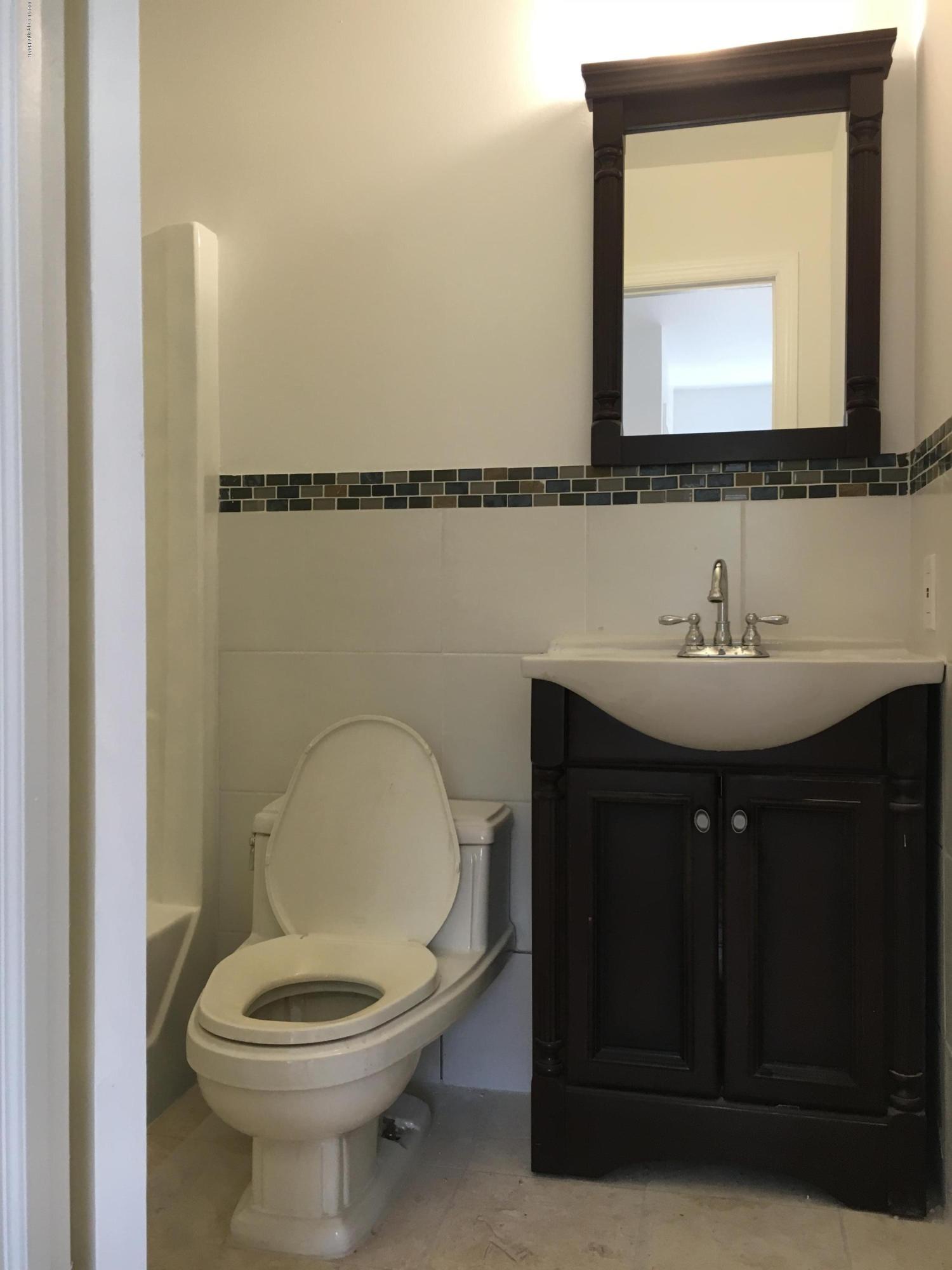 6229 Decker Road Bushkill, PA 18324 - Photo 3 of 15 a bathroom with a sink a toilet and mirror