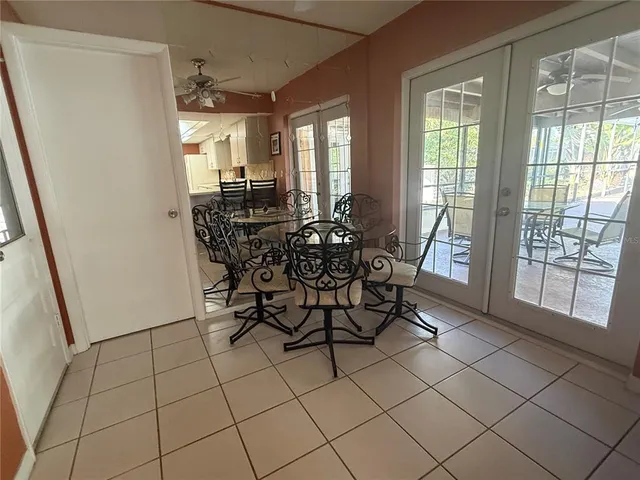 a view of a dining room with furniture and window