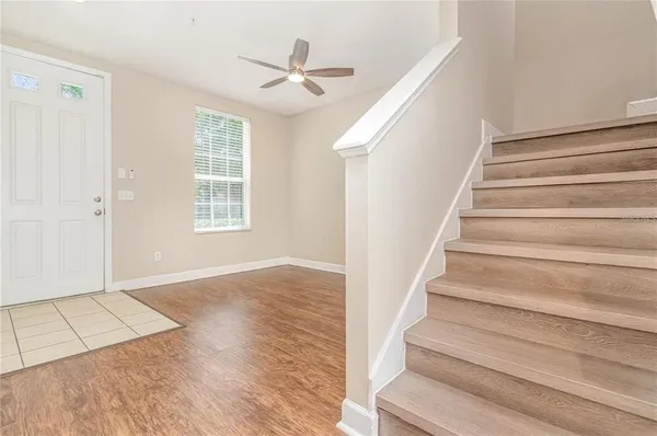 a view of an entryway with wooden floor