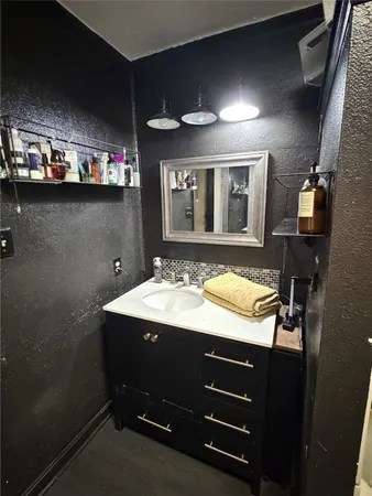 a bathroom with a sink double vanity and a mirror