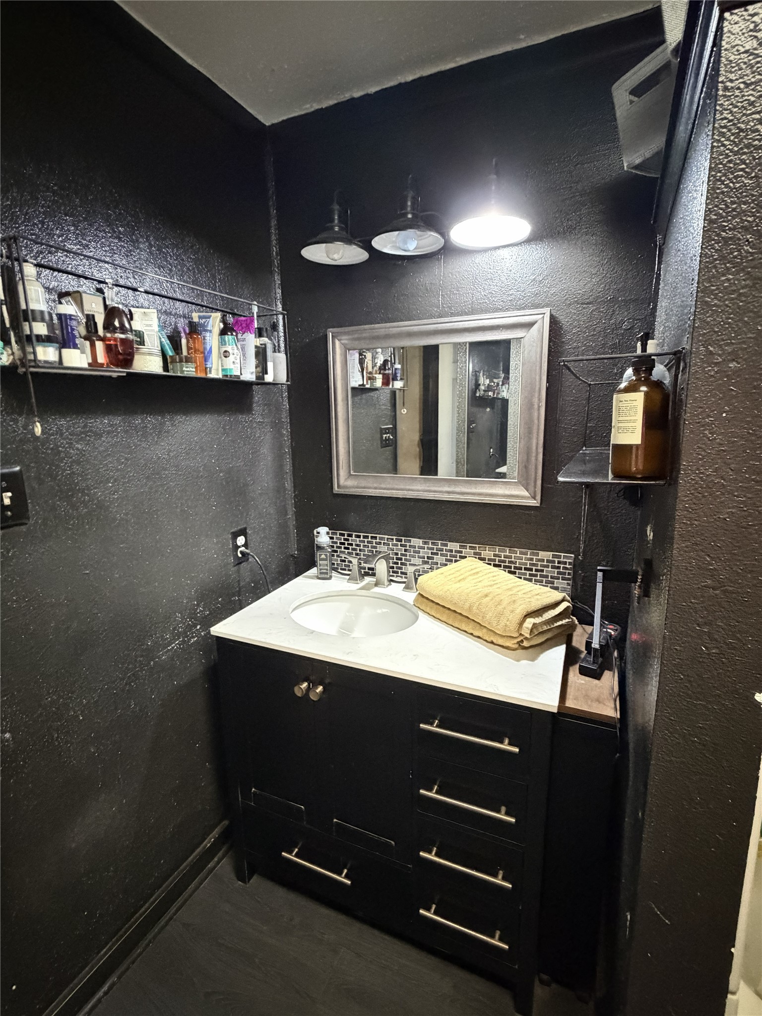 4710 9th Street Bacliff, TX 77518 - Photo 7 of 11 a bathroom with a sink double vanity and a mirror