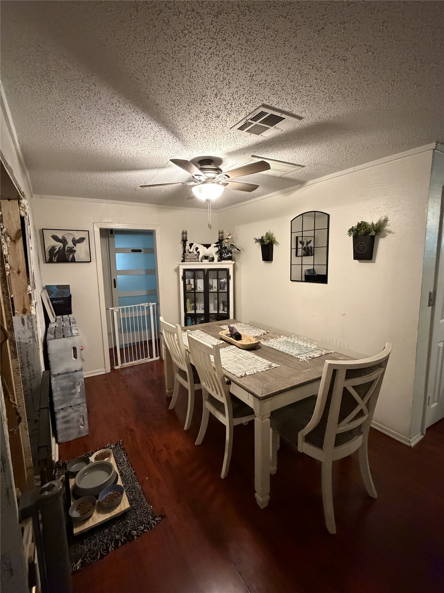 4710 9th Street Bacliff, TX 77518 - Photo 9 of 11 a view of a dining room with furniture and a chandelier