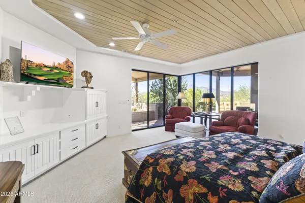 a outdoor space with lots of furniture and a fireplace