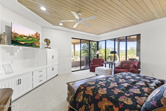 a outdoor space with lots of furniture and a fireplace