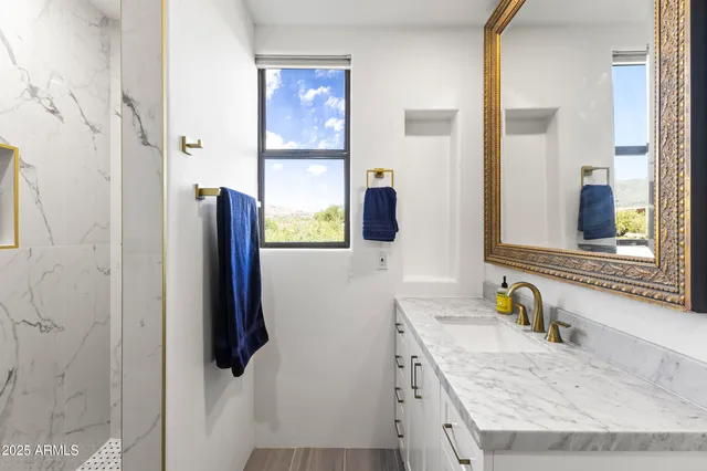 a bathroom with a bathtub and shower