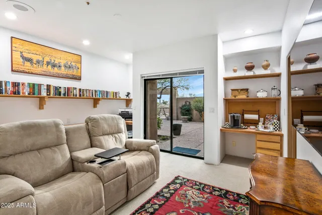 a kitchen with a dining table chairs and sink