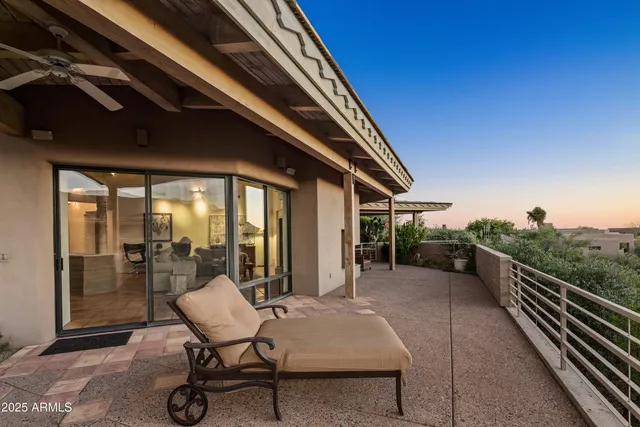 an aerial view of a house with garden space and sitting area