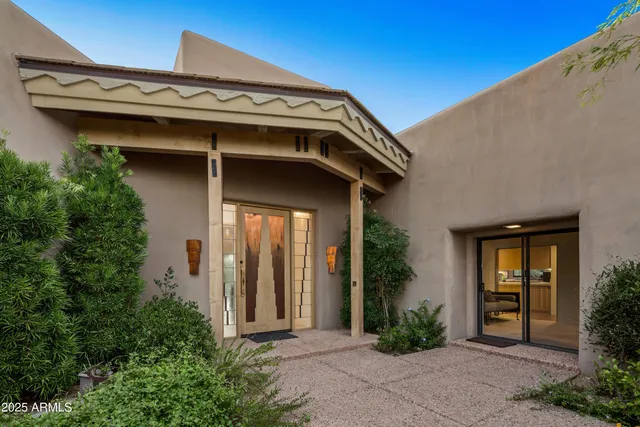 a view of a chairs and table in the balcony