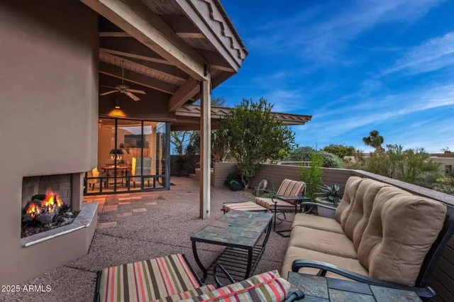 a view of a house with potted plants