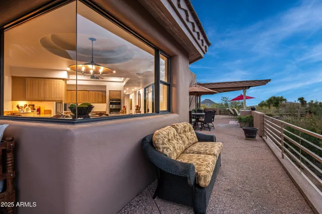 a terrace of a house with outdoor seating