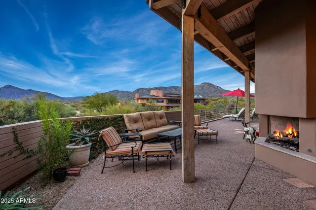 a view of city from balcony with furniture