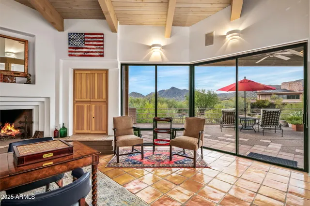 a living room with fireplace furniture and a flat screen tv