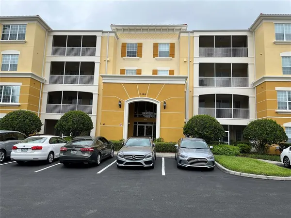 a building with car parked in front of it
