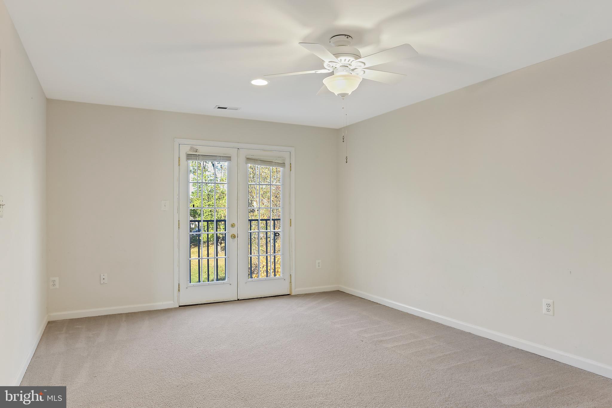 8680 Ridge Road Ellicott City, MD 21043 - Photo 18 of 43 Primary Bedroom ensuite with ceiling fan
