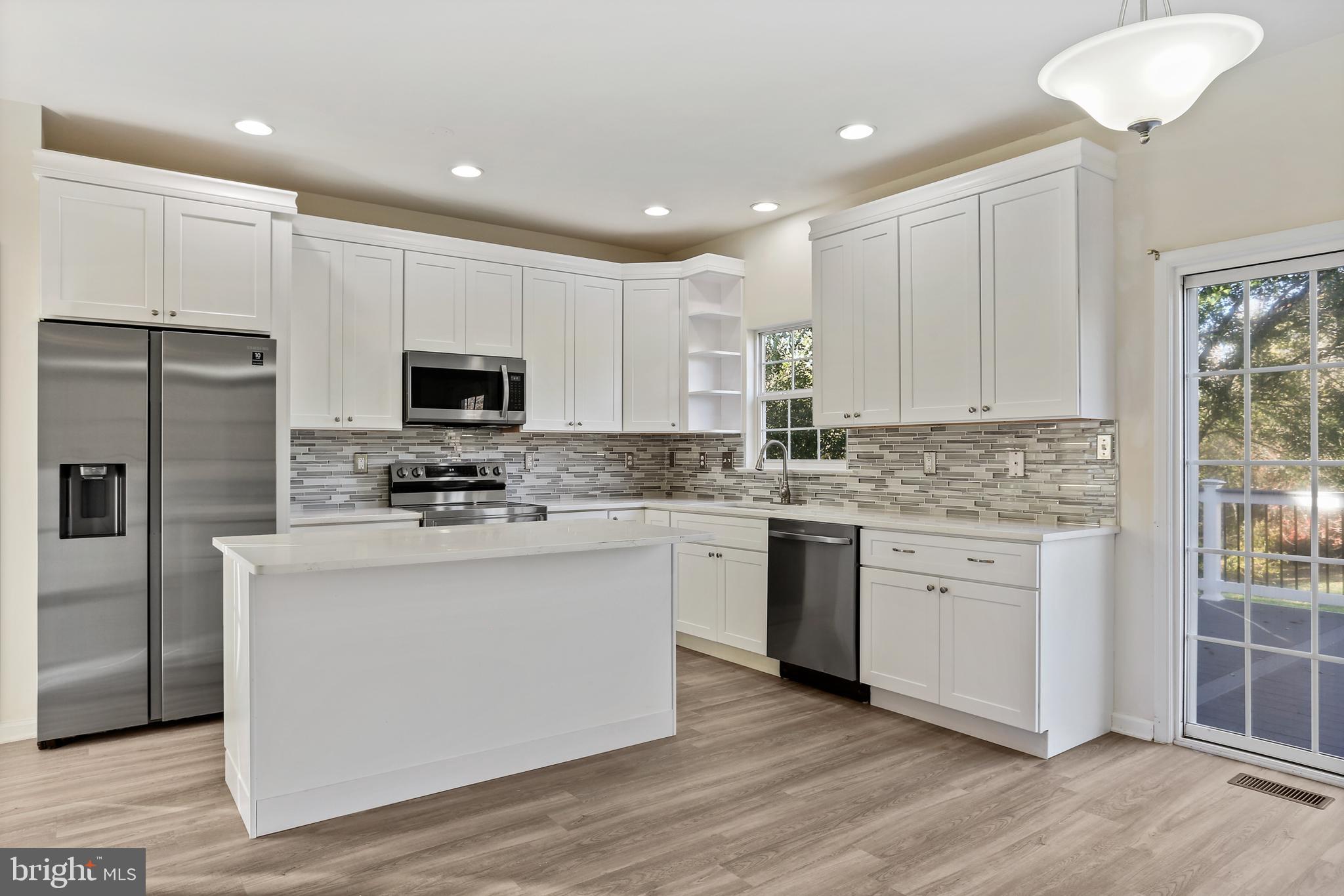 8680 Ridge Road Ellicott City, MD 21043 - Photo 2 of 43 Renovated Kitchen with island breakfast bar