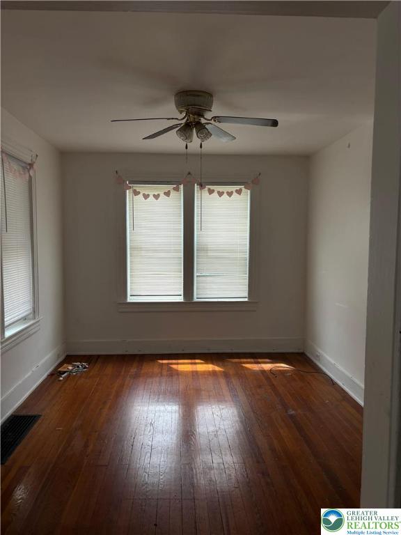 Undisclosed Address Easton, PA 18042 - Photo 3 of 9 a view of an empty room with wooden floor and a window