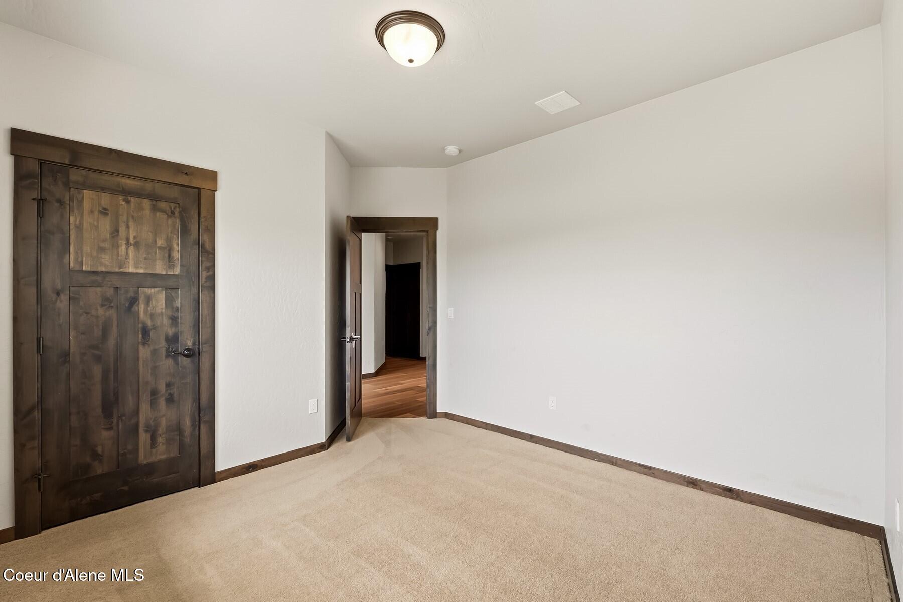 1317 Prominence Court Sandpoint, ID 83864 - Photo 24 of 44 Guest Bedroom #1