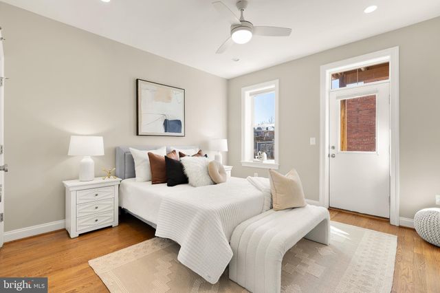 a bedroom with a bed and a couch