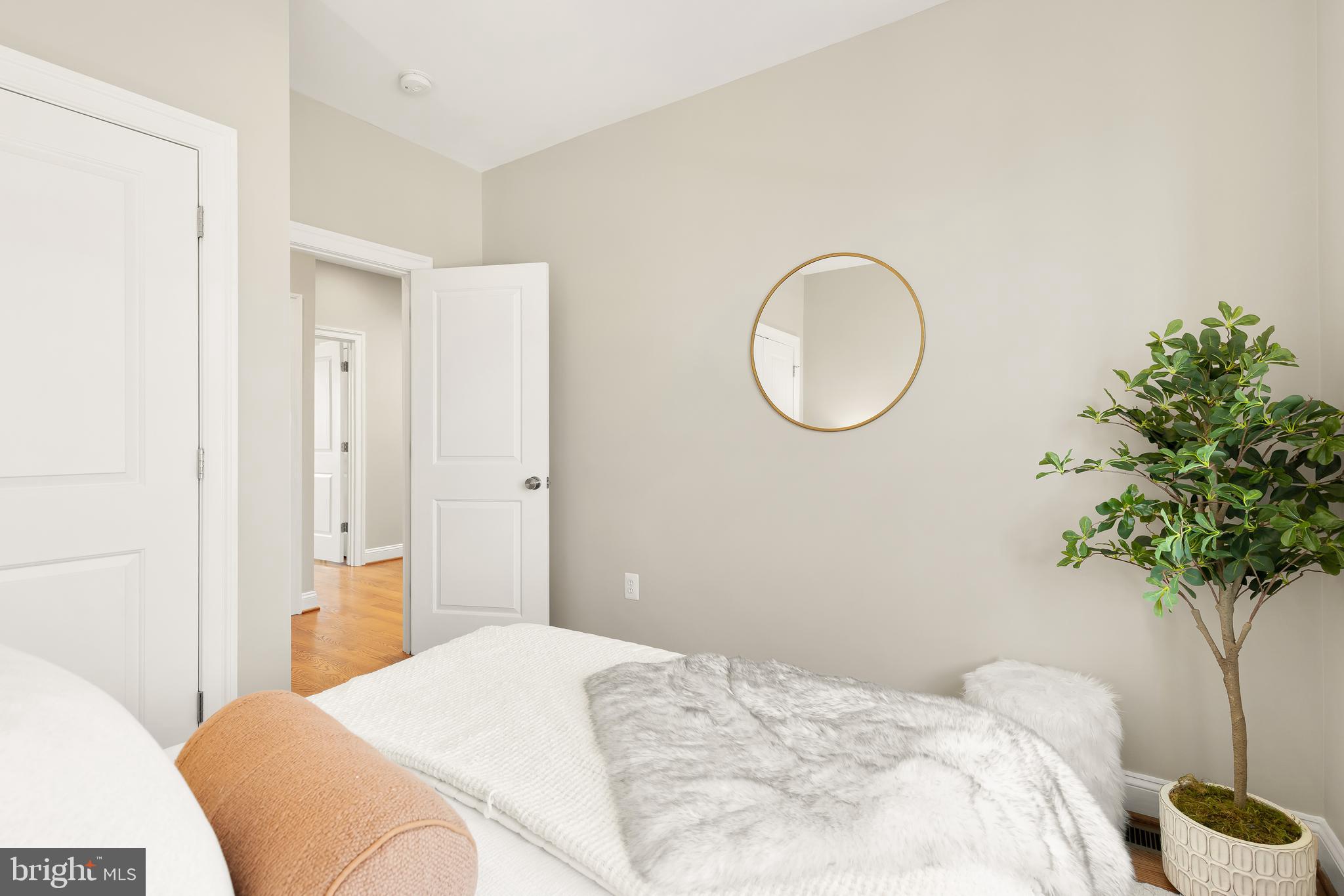 1722 2nd Street Northwest Washington, DC 20001 - Photo 19 of 33 a bedroom with a bed and a potted plant