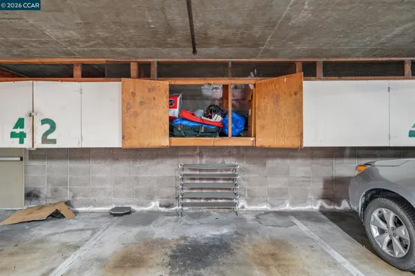 a utility room with stainless steel appliances and cabinets