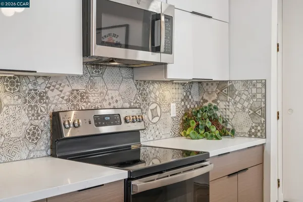 a kitchen with a stove and a microwave