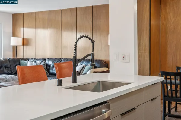 a kitchen with a sink and a large window